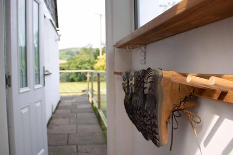 Walking boots hanging in the porch