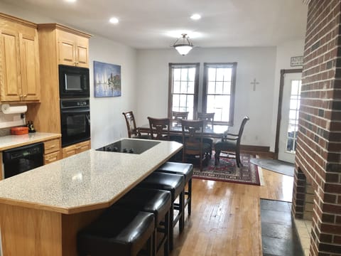 Kitchen & Dining Room with Lake View and Main Porch Access