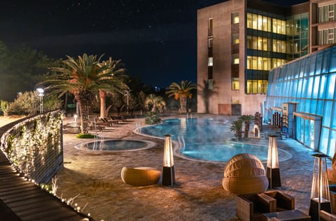 Indoor pool, outdoor pool, open 1:00 PM to 9:00 PM, pool umbrellas