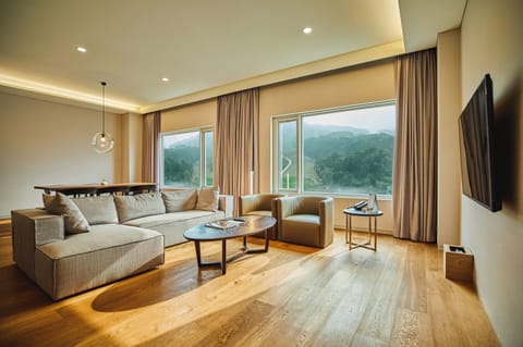Presidential Suite | Living area | 43-inch TV with cable channels, table tennis