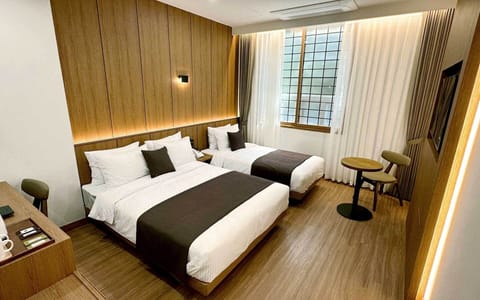 Deluxe Family Twin | Blackout drapes, soundproofing, free WiFi