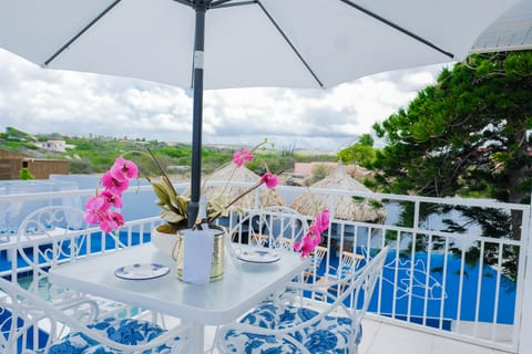 Balcony overlooking the ocean and the pool deck.