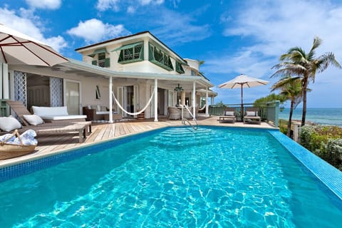 Overlooking the pool with large sun loungers