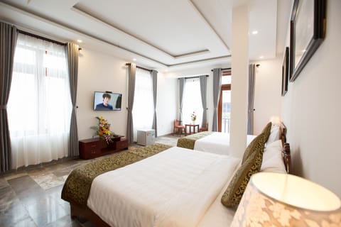 Family Quadruple Room | Premium bedding, minibar, desk, blackout drapes