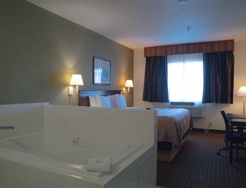 Suite, 1 King Bed, Non Smoking | Premium bedding, pillowtop beds, laptop workspace, blackout drapes