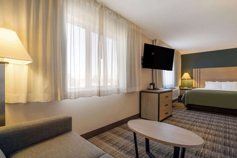 Desk, laptop workspace, blackout drapes, iron/ironing board