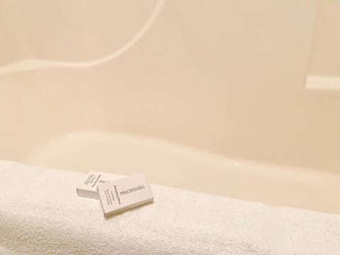 Combined shower/tub, towels, soap, shampoo