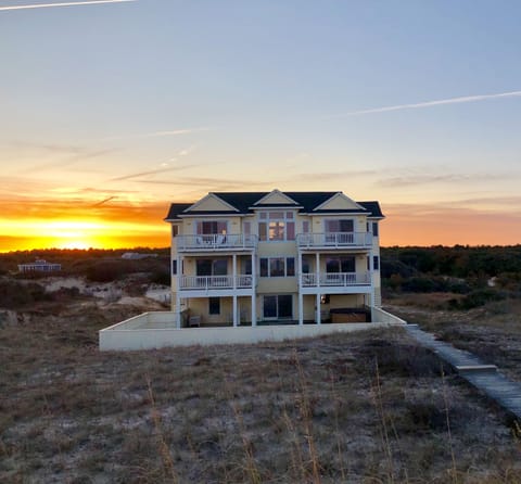 Sunsetting behind Away From It All..photo taken while at the ocean facing home