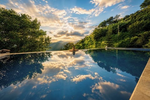 Outdoor pool, open 6:00 AM to 10:00 PM, sun loungers