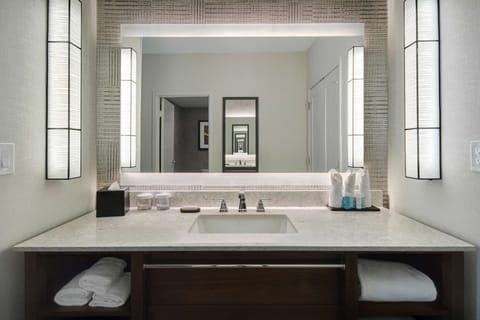 Suite, 1 King Bed (Conference) | Bathroom | Combined shower/tub, designer toiletries, hair dryer, towels
