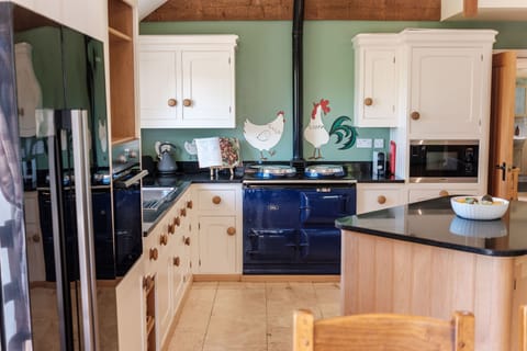 Kitchen area in Mole End, complete with AGA and electric oven