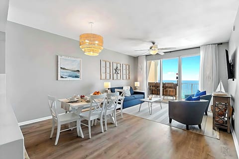 Beachfront living room with balcony—soak in ocean views from sunrise to sunset.