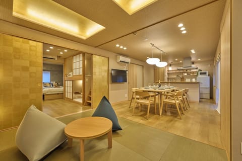 Family Suite | Living area | Flat-screen TV, first-run movies