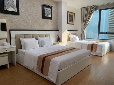Family Room | Minibar, desk, blackout drapes, free WiFi