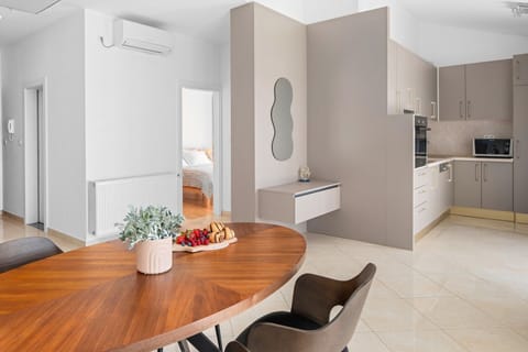 Fully equipped kitchen with dining table and direct exit to the terrace with amazing sea view