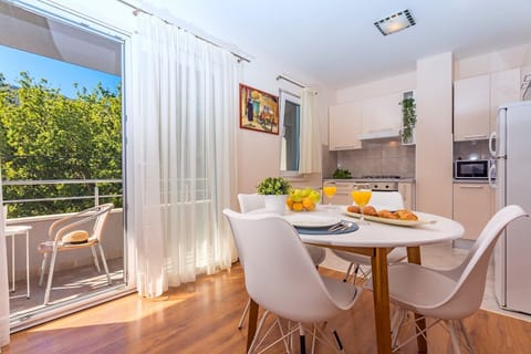 Kitchen and living area in AP1 with balcony