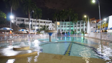 Outdoor pool, open 7:00 AM to 9:00 PM, pool umbrellas, sun loungers