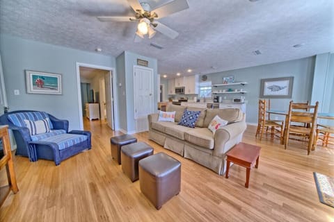 Open-concept living meets cozy charm in this inviting space, perfect for unwinding or enjoying meals with loved ones