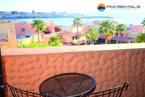 Balcony with a beautiful pool and port view