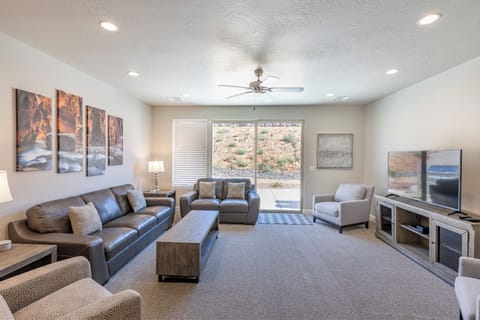 Living Room View - The living room is designed as an open floor plan and is a great gathering place for meals, games, or watching TV during your stay.