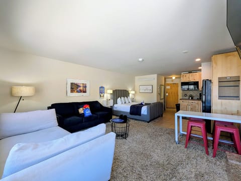 Unwind in your stylish studio with plush seating, modern kitchenette, and thoughtful touches that make every moment feel like home.