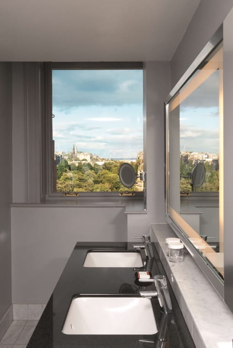 Shower, designer toiletries, hair dryer, bathrobes