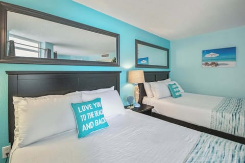 Discover the quiet side of vacation in this beautifully furnished bedroom escape.

