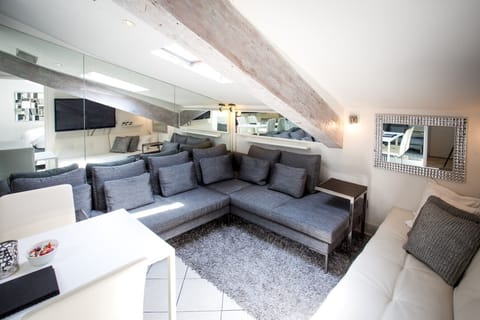 Living room with sofa group and extra bed: An alluring living room arrangement featuring sofas and a convertible extra bed, where lavishness meets practicality.
