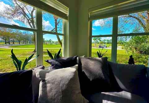 View from Golf Villa living room: overlooking PGA Golf Club at PGA Village's Driving Range, Pitch-n-Putt course, Short Game area, and Clubhouse. 