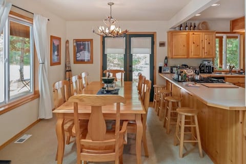 Dining room table seats eight. Kitchen bar, four.  