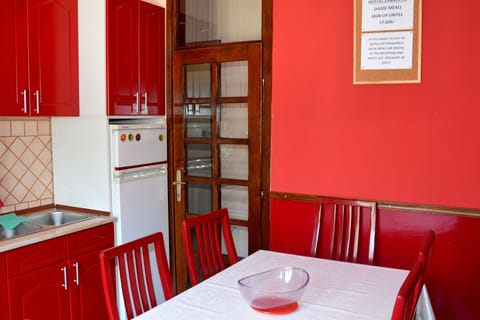 Full-size fridge, microwave, stovetop, cookware/dishes/utensils