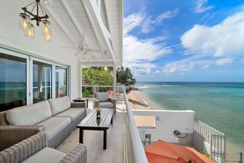 A spacious covered deck, and stunning views of the turquoise Caribbean Sea