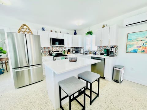 Stocked kitchen plus additional island seating.