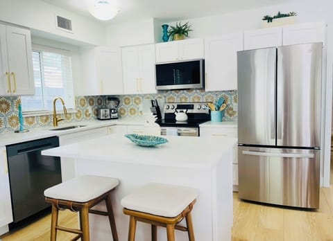 New kitchen island and brand new appliances including a dishwasher.