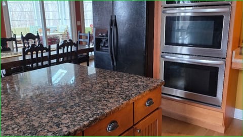 Double oven and refrigerator in kitchen