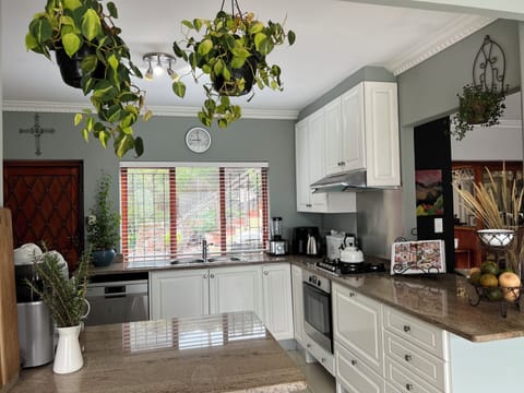 Villa | Private kitchen | Fridge, microwave, oven, stovetop