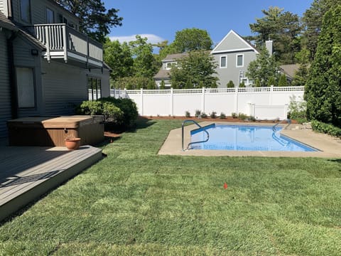 The perfect backyard for summer fun. A brand new hot tub and pool await.