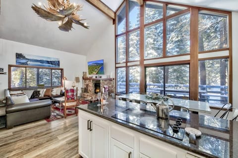 Dining room area, living room, and fully renovated kitchen — all connected for an open, seamless flow.