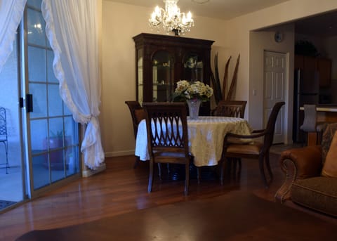 Dining room. Living room furniture in foreground has been replaced with new set.