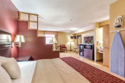 Desk, laptop workspace, iron/ironing board, free cribs/infant beds