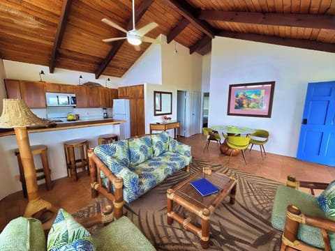 The kitchen, living room and bar create a charming great room 