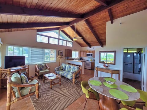 Spacious living room and bar area, with huge ceilings