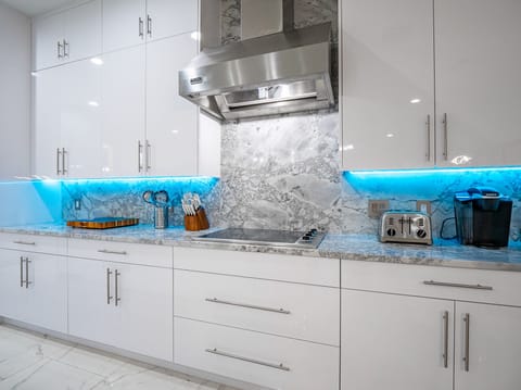 Viking Professional 5 Series Induction Cooktop with a Stainless Viking Hood