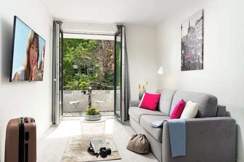 Off-Site One-Bedroom Apartment with Balcony | Living area | 55-cm LCD TV with cable channels, TV