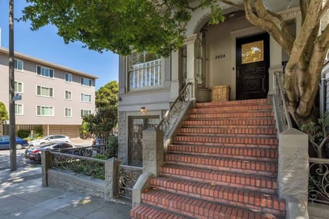 Charming entrance with classic brick steps and elegant details, welcoming you to this beautiful home.