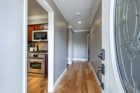 Fresh and inviting hallway that opens seamlessly into your stylish cooking space