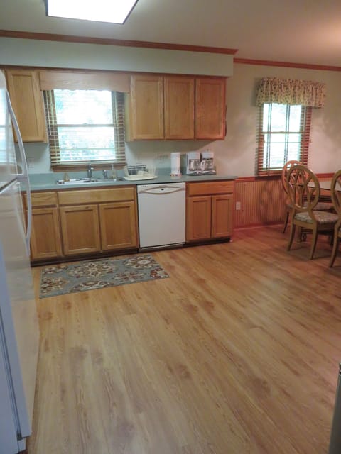Large kitchen has new appliances - stove, dishwasher, microwave, refrigerator
