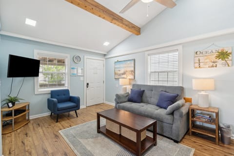 Another view of the open concept living space, with vaulted ceilings that give this space an open and airy feel.