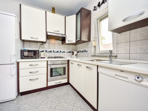 Cabinetry, Room, Countertop, Property, Kitchen, Furniture, Interior Design, Major Appliance, Building, Yellow