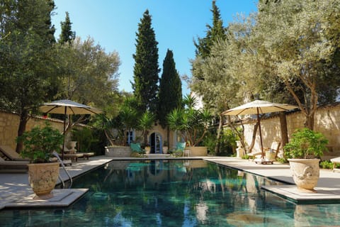 Outdoor pool, open 6:00 AM to 9:00 PM, pool umbrellas, sun loungers